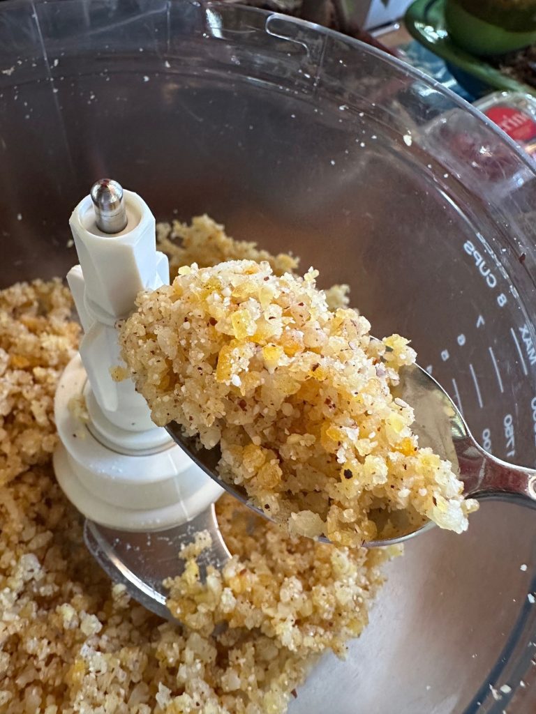 Candied peel with almond/hazelnut meal in food processor, pre-blitz.